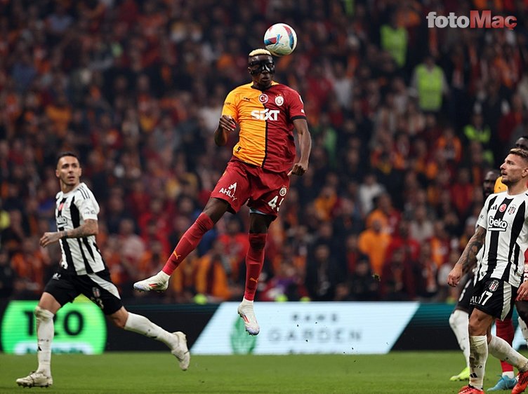Victor Osimhen scores a header for Galatasaray 2025 Süper Lig Champions at RAMS Park, with the crowd roaring and red and yellow flares adding intensity.