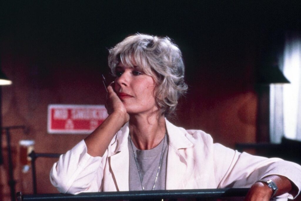 Loretta Swit as Major Margaret Houlihan in MASH*, in a nurse uniform, showcasing her iconic role with a confident, nostalgic vibe